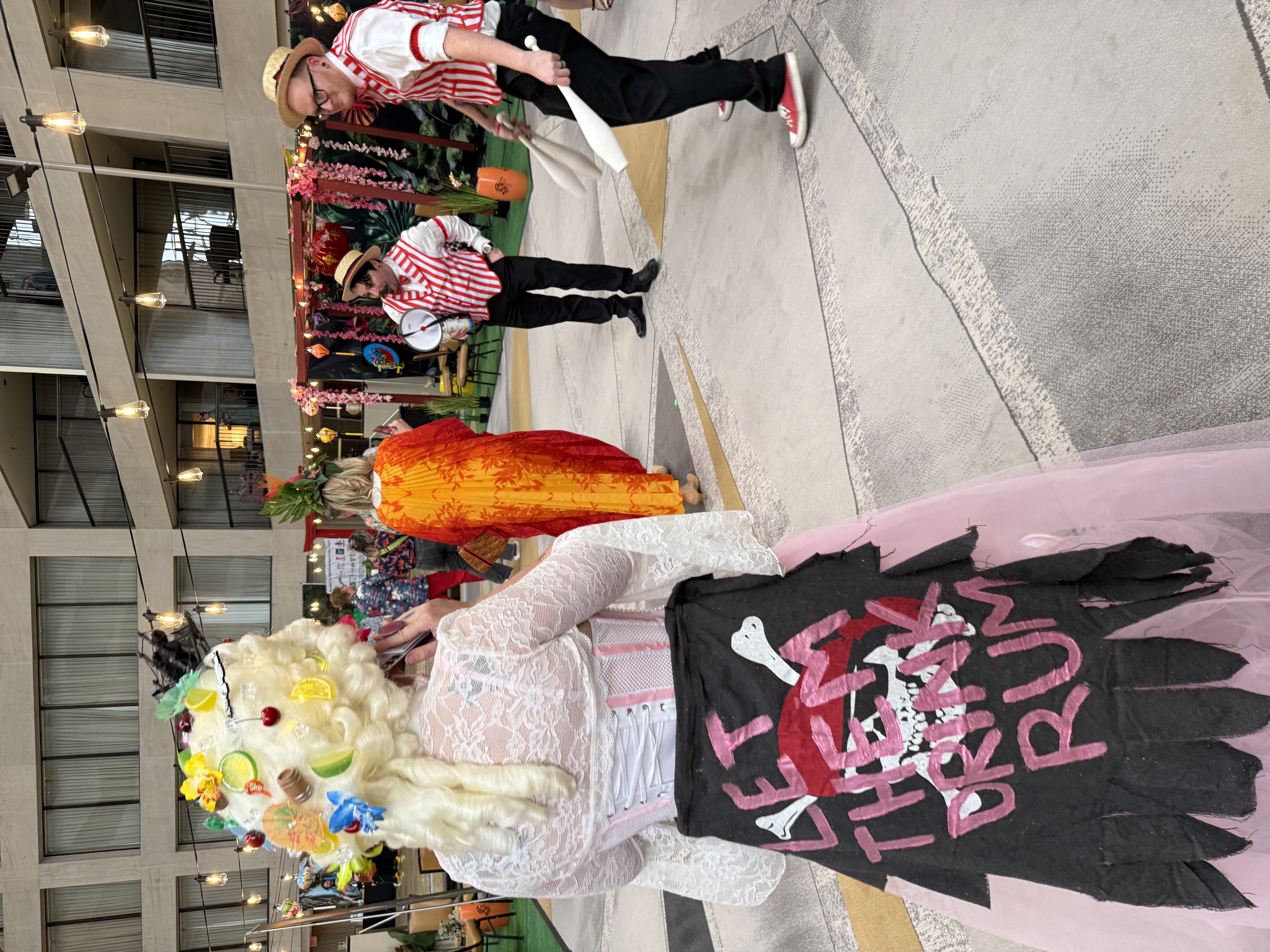"Let Them Drink Rum." Tiki Marie Antoinette watches carnival jugglers in the atrium. Just another Saturday night.