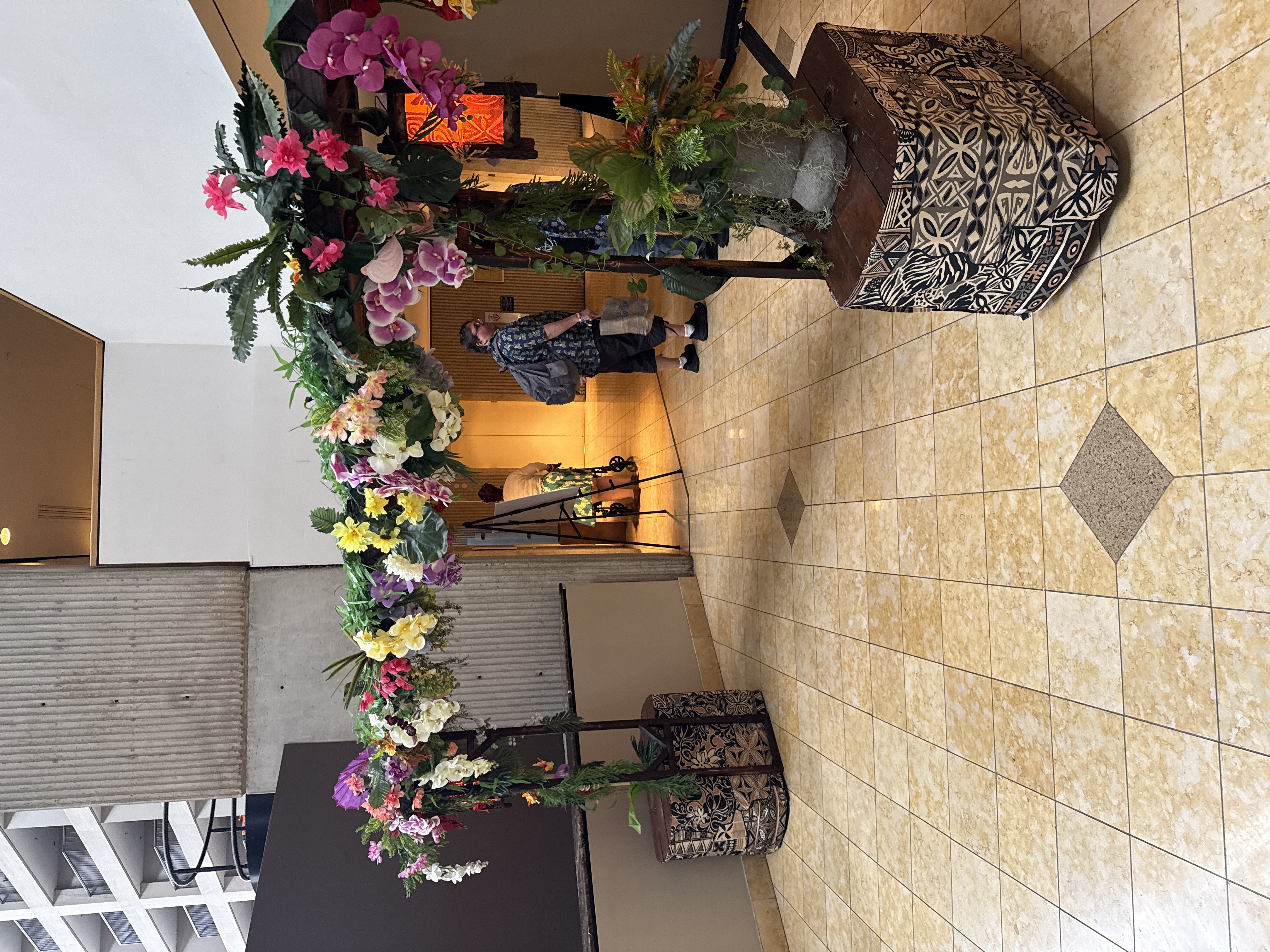 Floral arch with tropical flowers at the entrance to the convention space